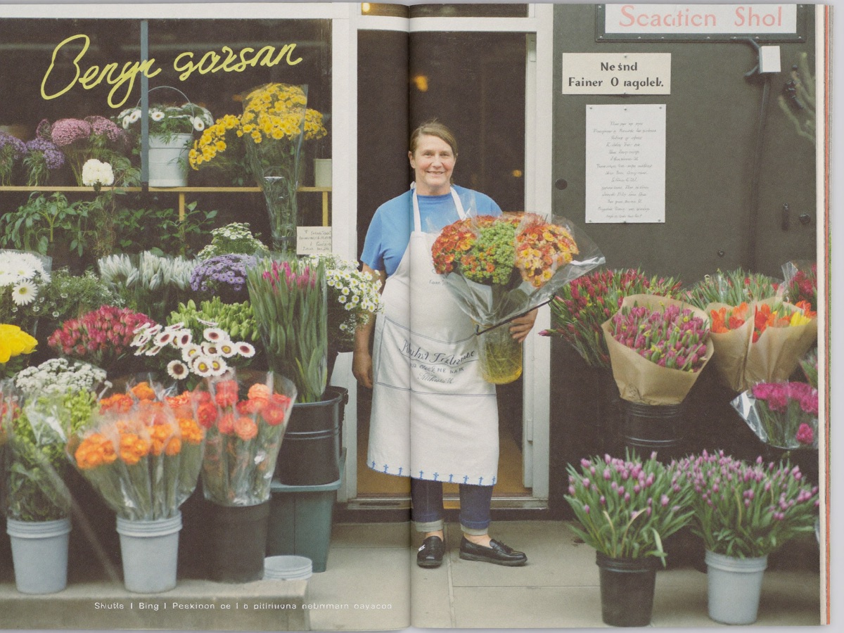 A florist at the doorway of her shop